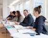 Motivierte Studierende einer Klasse der Benedict St. Gallen